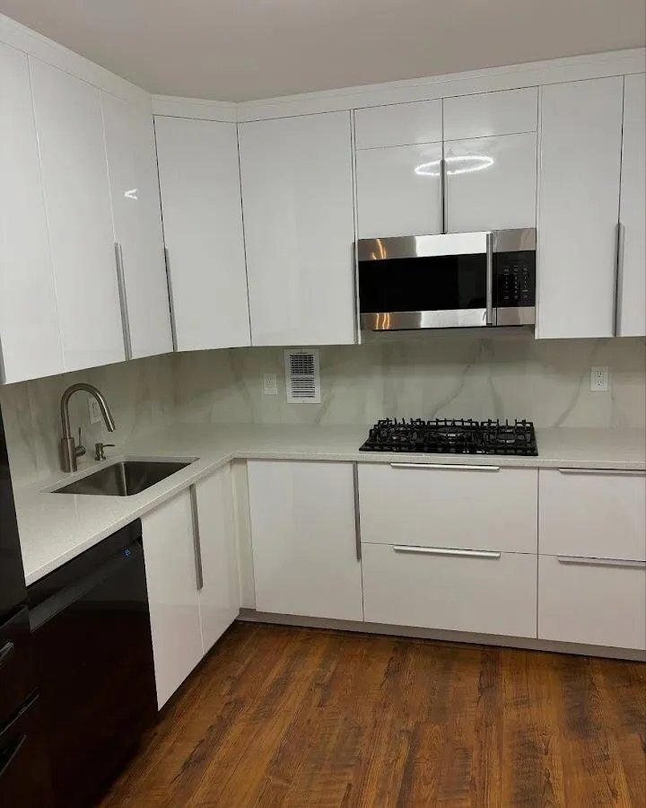 Restored kitchen with white cabinets after water damage in Somerville